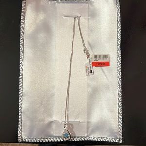 New with tags love in motion necklace gemstone addition. Gemstone is aquamarine